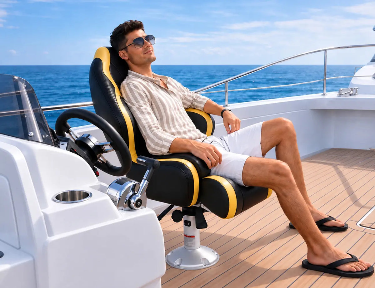 Man relaxing in a Marinexplore black and yellow captain chair at the helm of a boat.