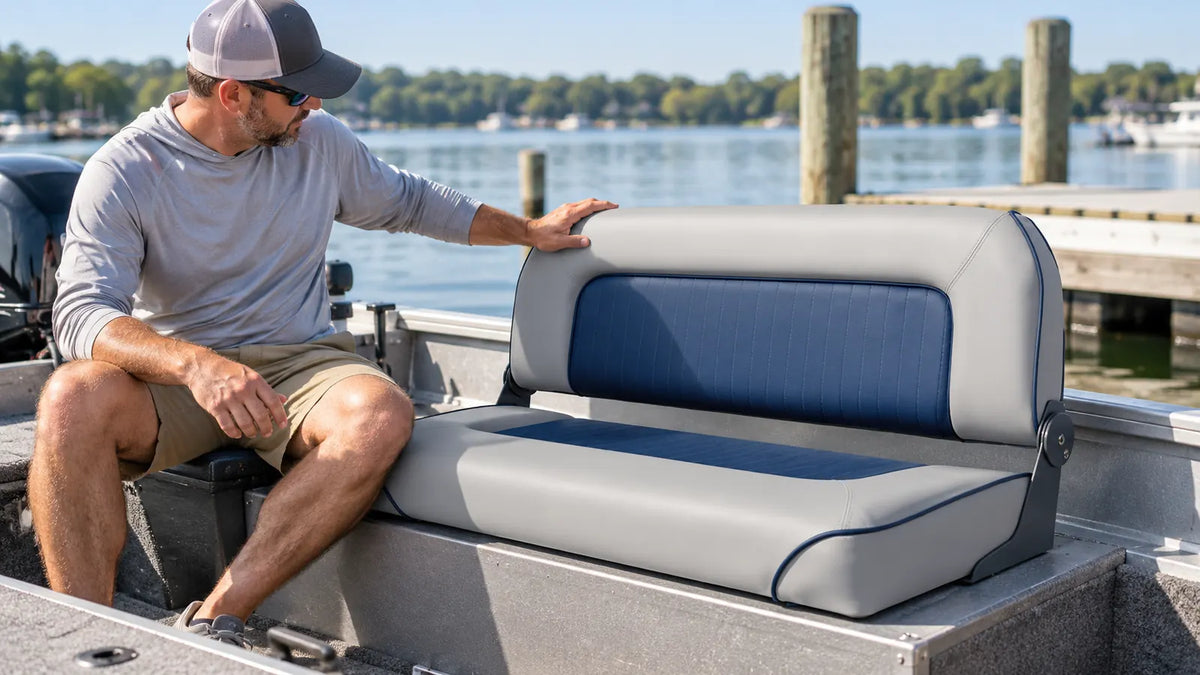 Boat owner checking the folding backrest of a double boat bench seat while the boat is secured at the dock
