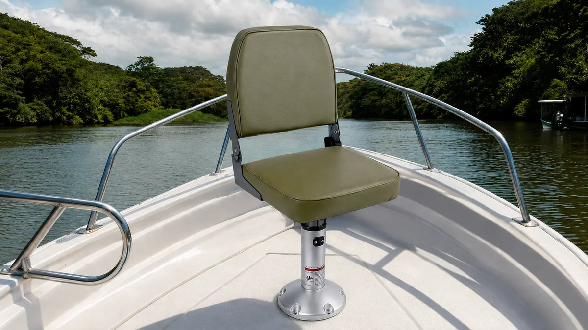 Olive-green folding boat seat on an adjustable pedestal with a round deck base at the bow of a recreational boat.