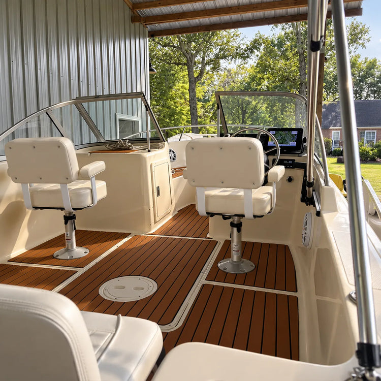Customer photo of two white captain's seats mounted on pedestals in a covered boat cockpit.