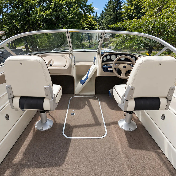 Customer-installed white captain's seats on silver boat seat pedestals in an open boat cockpit.