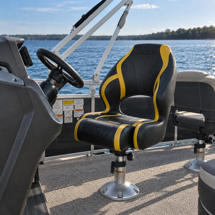 Black and yellow captain chair mounted on a pedestal at a boat helm.