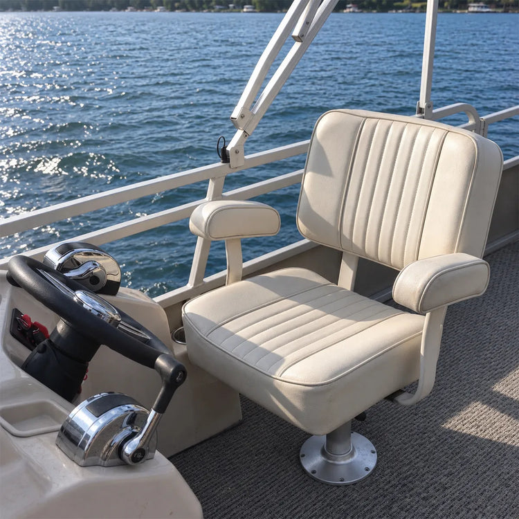 White captain chair with armrests mounted at a boat helm.