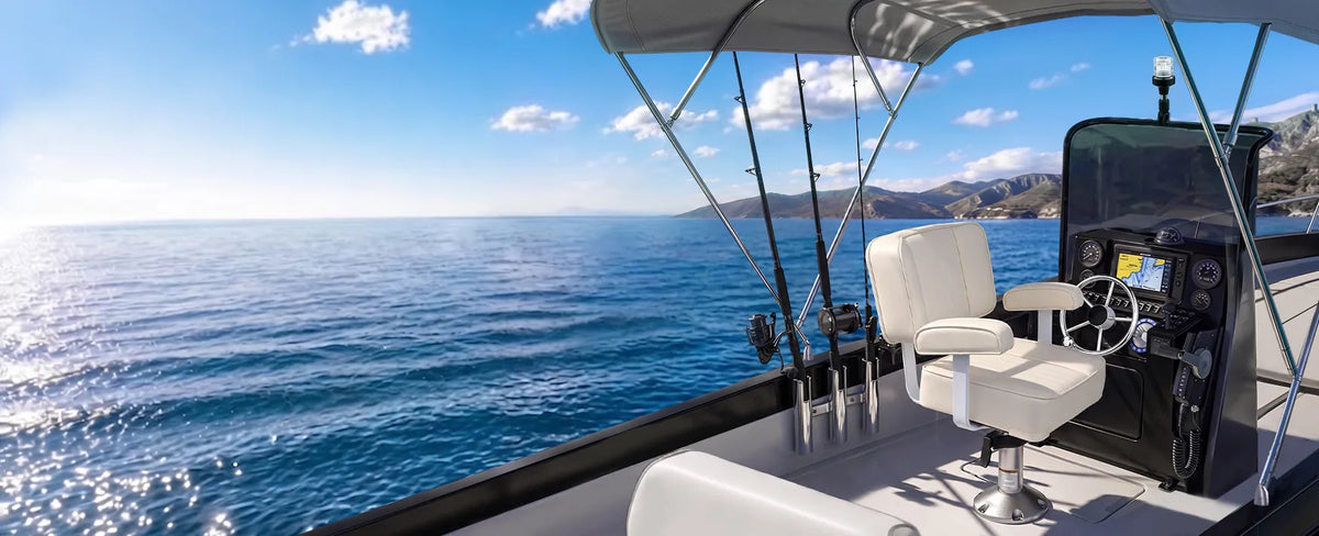 White Marinexplore helm seat on a center console fishing boat cruising on open water.