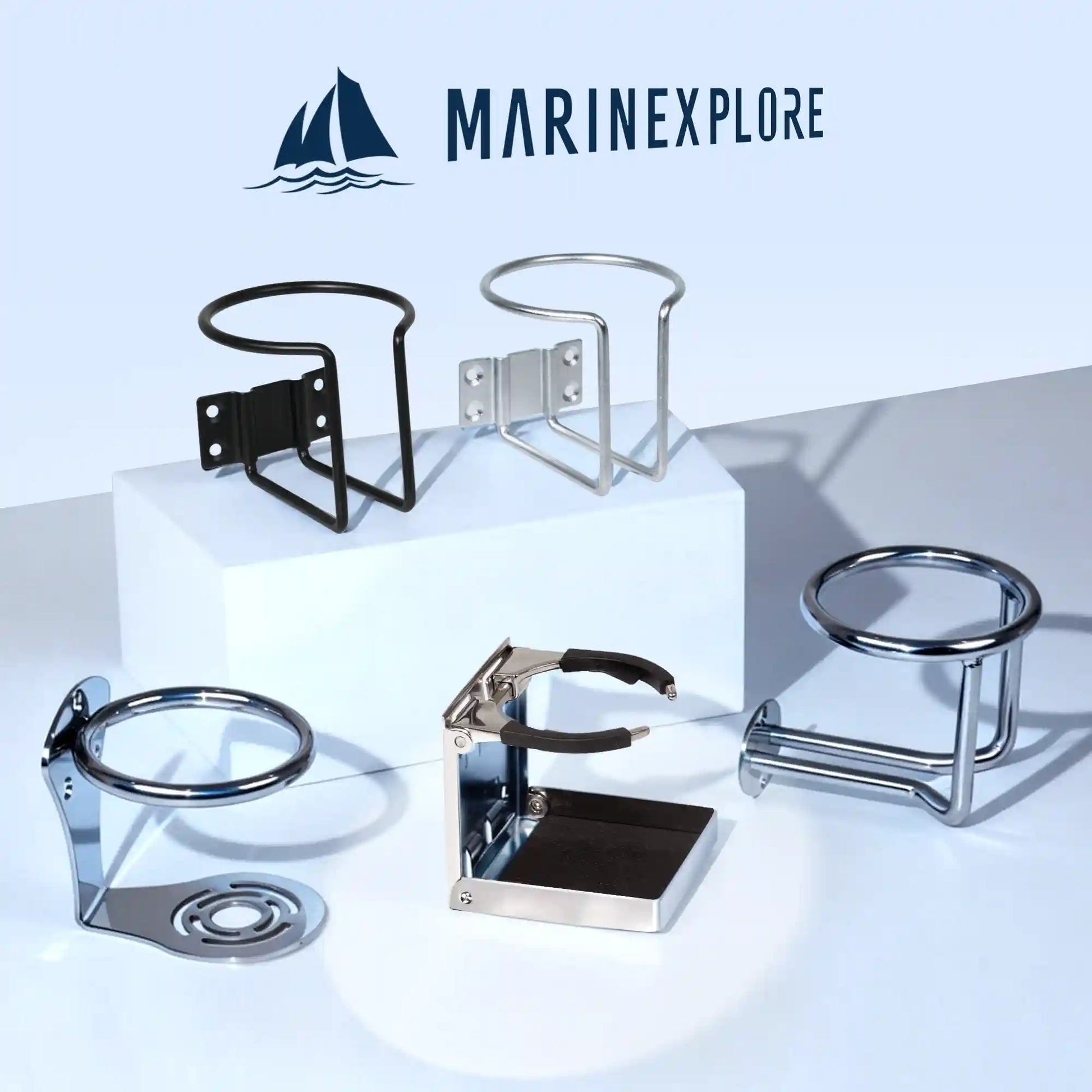 Marinexplore brand logo at the top with five different boat cup holder models displayed on a white studio surface, including a black wire-frame wall-mount, silver wire-frame wall-mount, chrome hourglass-base ring holder, the chrome folding cup holder featured in this listing shown in its expanded position, and a chrome cylindrical surface-mount holder.