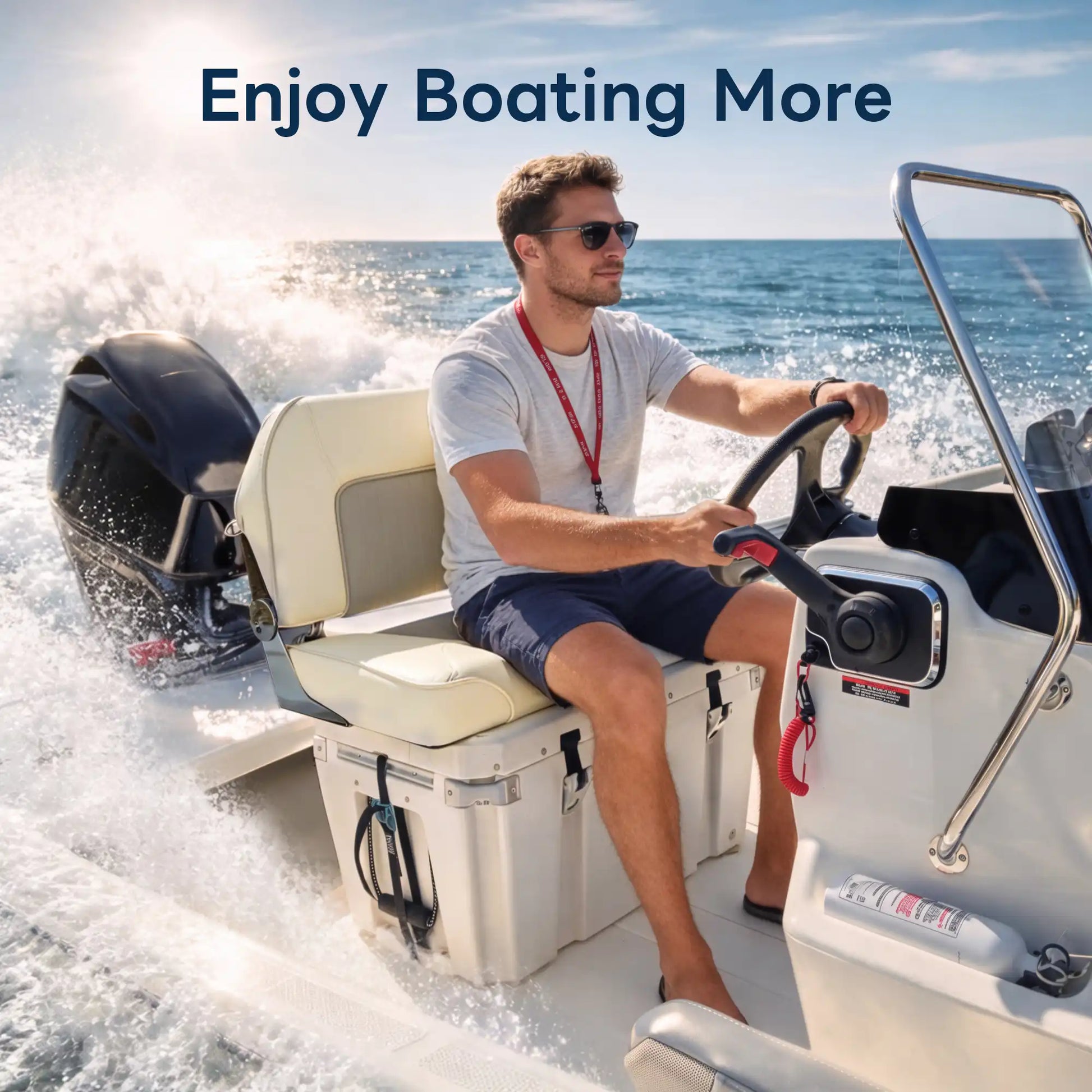 Man driving a motorboat comfortably while sitting on a durable cream-colored marine-grade bench seat.