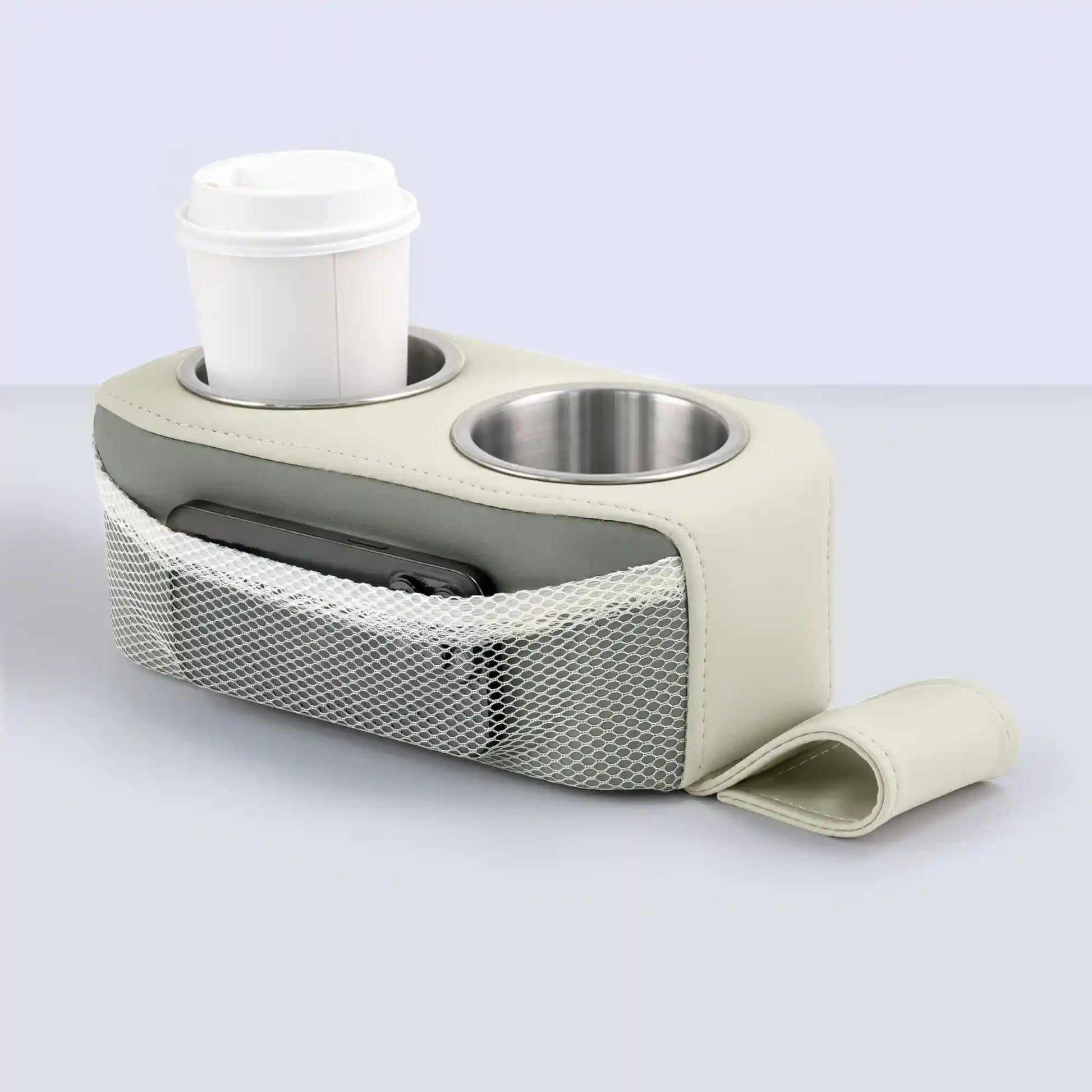 Marinexplore white and gray two-tone PU leather pontoon cup holder with a gray accent band along the body, dual stainless steel cup inserts, a white coffee cup in the left slot, a black phone in the white mesh side pocket, and the anchor strap laid flat in front.