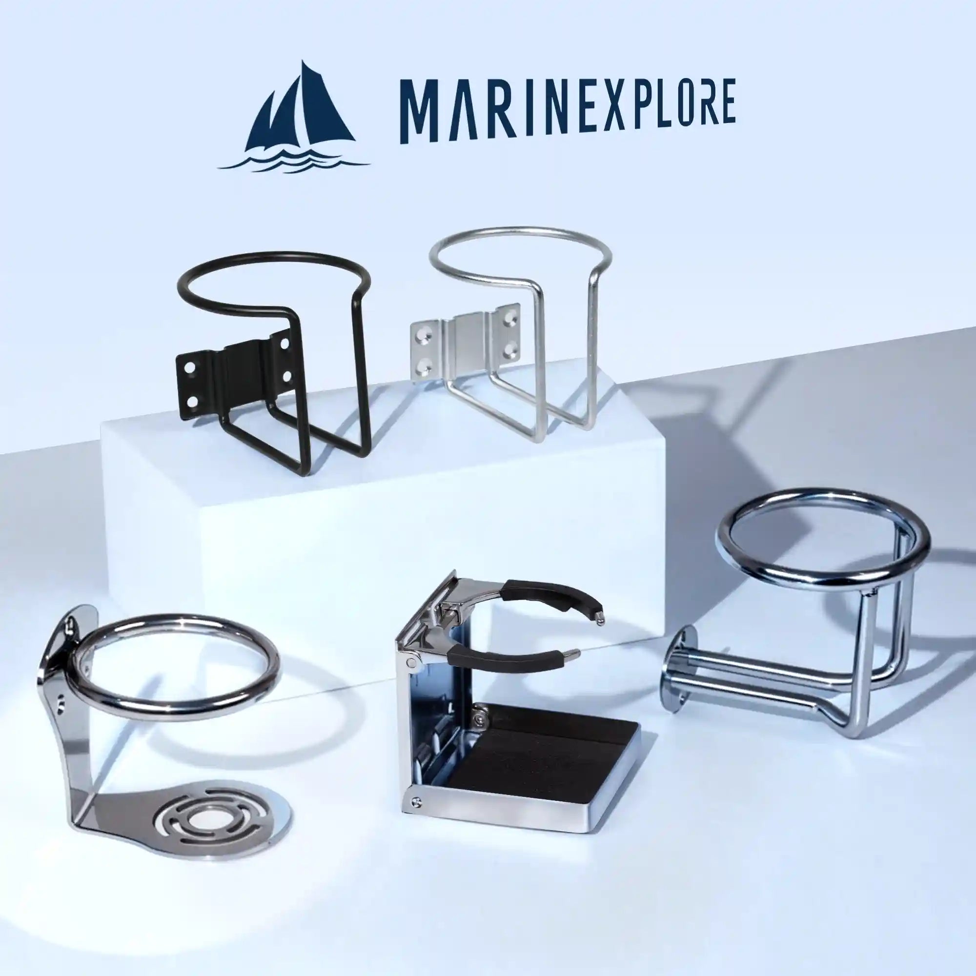 Marinexplore brand logo at the top with five different boat cup holder models displayed on a white studio surface, including a black wire-frame wall-mount, silver wire-frame wall-mount, the chrome hourglass-base ring cup holder featured in this listing, a folding adjustable chrome holder, and a chrome cylindrical surface-mount holder.