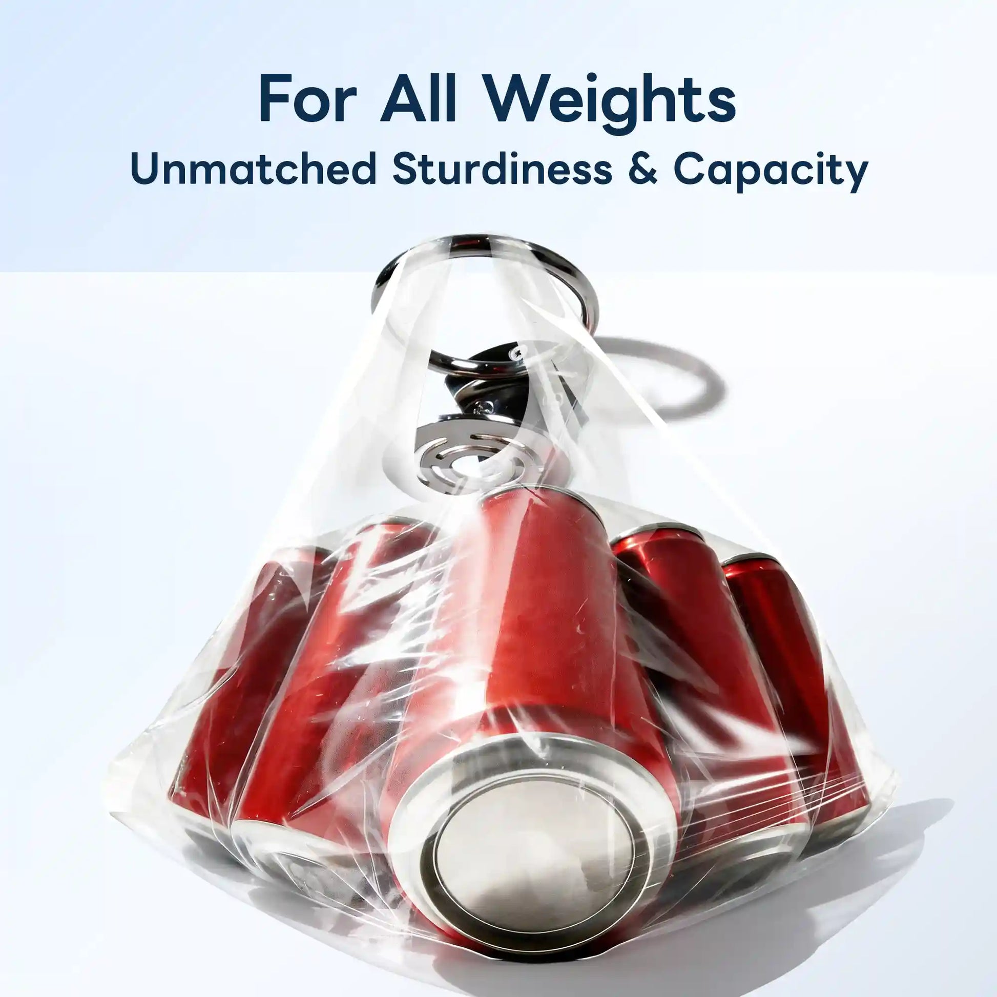Marinexplore chrome stainless steel ring boat cup holder flipped upside down and used as a handle to lift a clear plastic bag loaded with multiple red soda cans, with the perforated base plate gripped at the top, proving the holder's exceptional structural strength and load capacity.