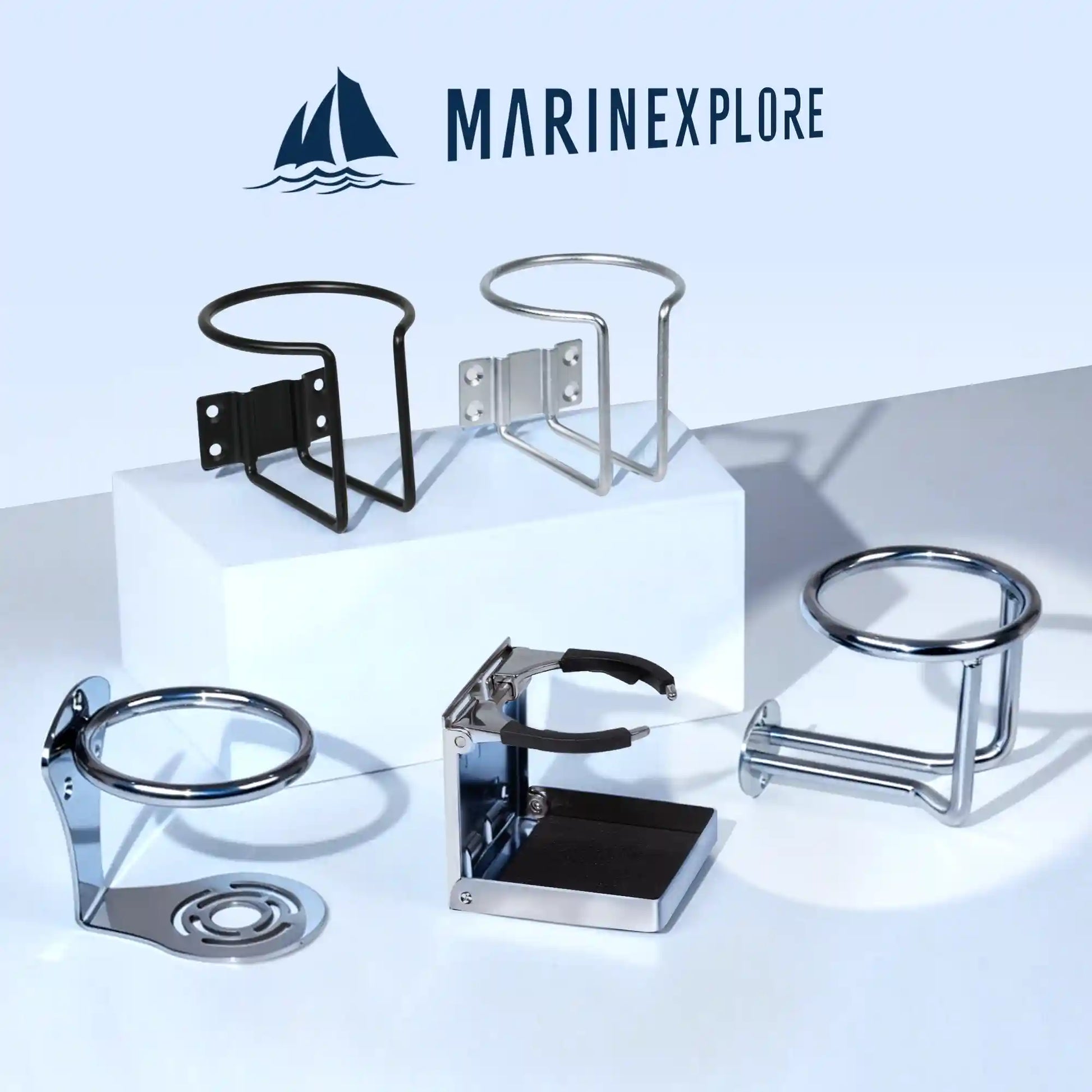 Marinexplore brand logo at the top with five different boat cup holder models arranged on a white studio surface, including a black wire-frame wall mount, silver wire-frame wall mount, chrome flush-mount ring base, folding chrome adjustable holder, and the chrome ring-style surface mount cup holder featured in this listing.