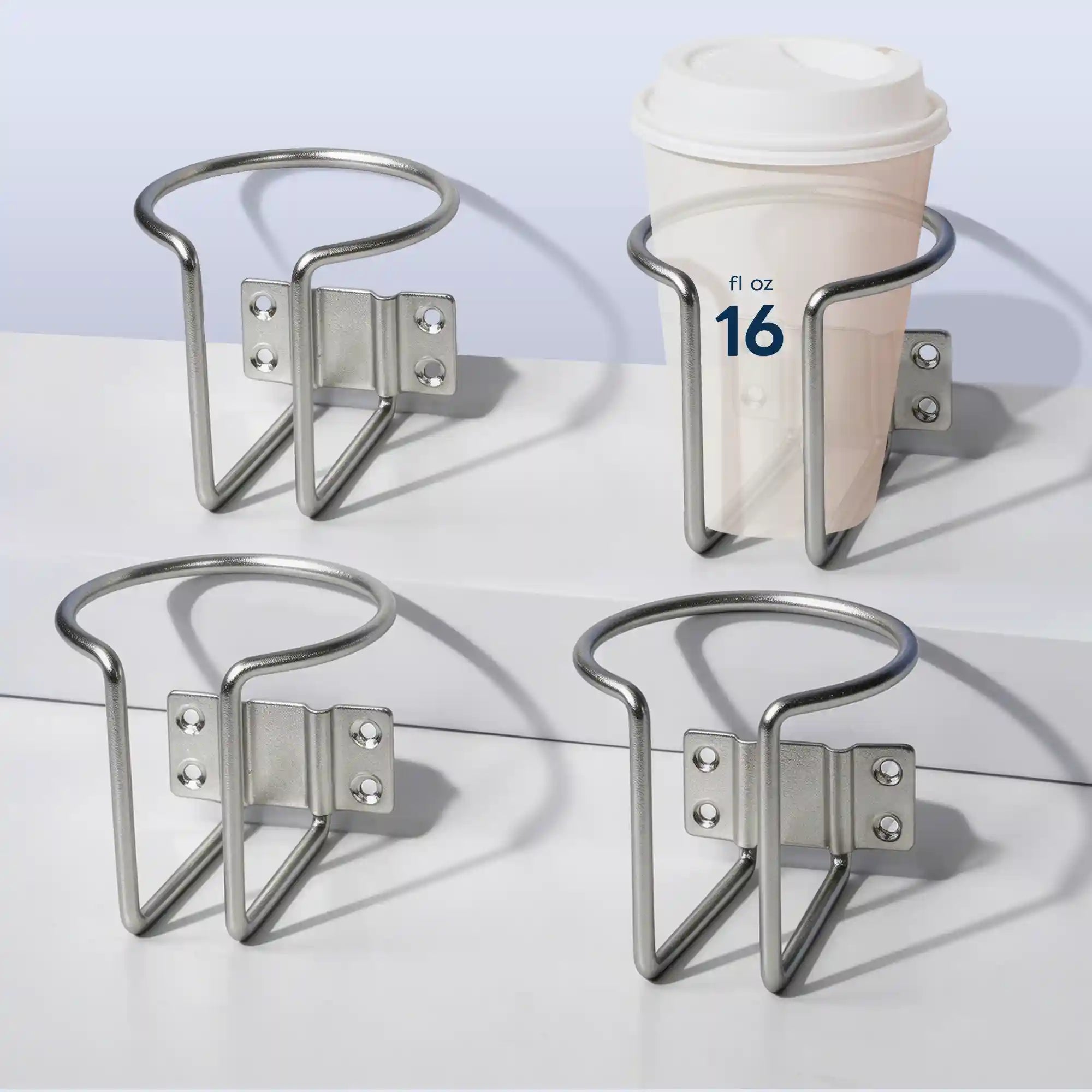 Four views of Marinexplore silver stainless steel wall-mounted boat cup holders arranged on a white surface, with one holder securing a 16 fl oz white lidded coffee cup to demonstrate real capacity and ring size.