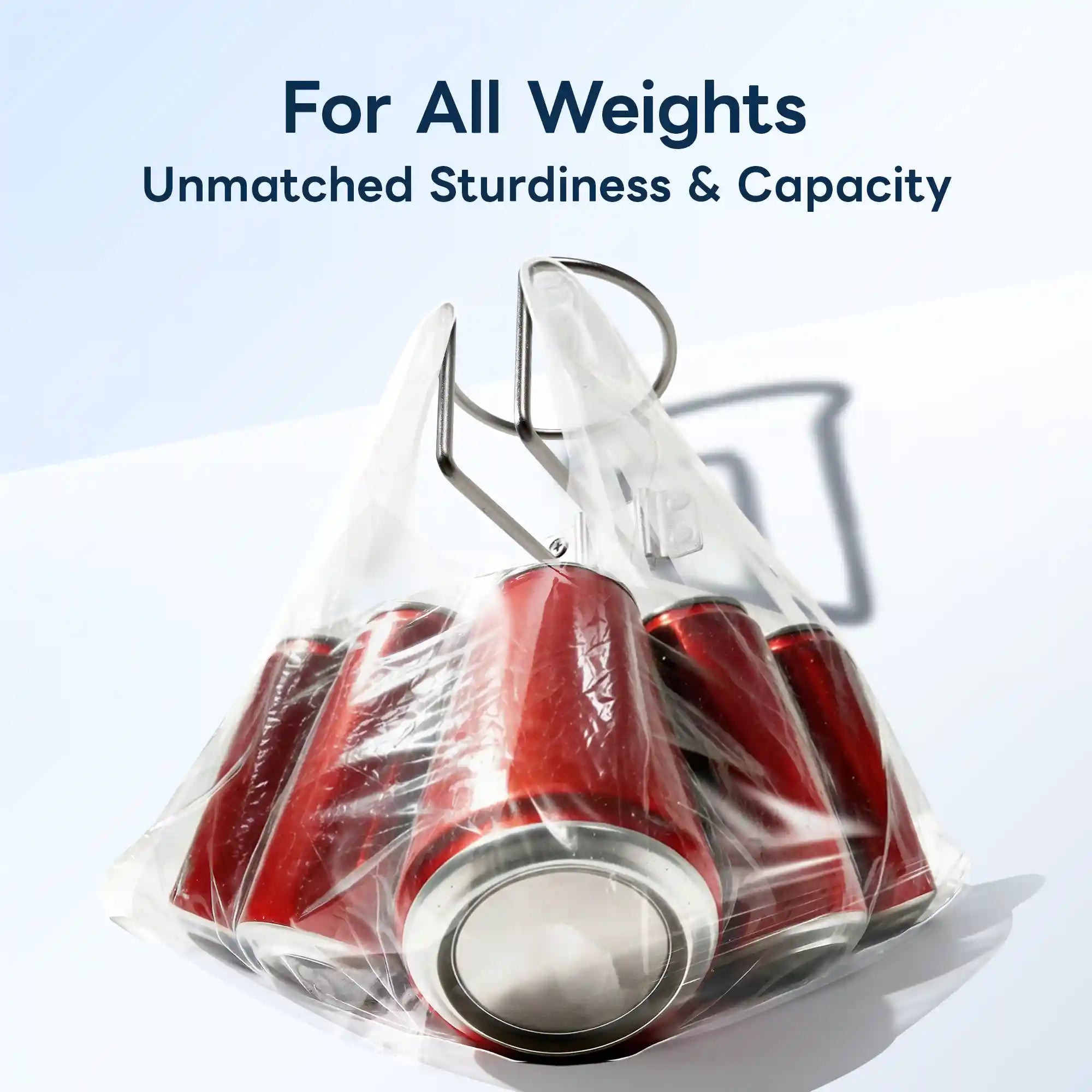 Marinexplore silver stainless steel boat cup holder being used to lift a clear plastic bag packed with multiple red soda cans, demonstrating exceptional load-bearing strength and structural durability.
